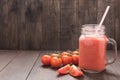 Healthy vegetable. Glass of red tomato juice on wooden table Royalty Free Stock Photo