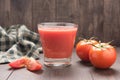 Healthy vegetable. Glass of red tomato juice on wooden table Royalty Free Stock Photo