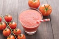 Healthy vegetable. Glass of red tomato juice on wooden table Royalty Free Stock Photo