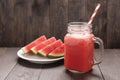 Healthy vegetable. Glass of red tomato juice on wooden table Royalty Free Stock Photo