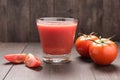 Healthy vegetable. Glass of red tomato juice on wooden table Royalty Free Stock Photo