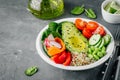Healthy vegetable lunch Buddha bowl. Avocado, quinoa, tomatoes, cucumbers, radishes, spinach, carrots, paprika and edamame beans s Royalty Free Stock Photo