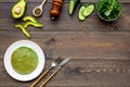 Healthy vegetable pancake. Spinach pancakes served with cucumber, avocado and greenery on dark wooden background top Royalty Free Stock Photo