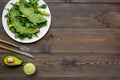 Healthy vegetable pancake. Spinach pancakes served with cucumber, avocado and greenery on dark wooden background top Royalty Free Stock Photo