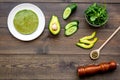 Healthy vegetable pancake. Spinach pancakes served with cucumber, avocado and greenery on dark wooden background top Royalty Free Stock Photo