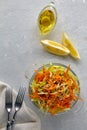 Healthy vegetable salad of cabbage and carrots with sesame seeds and olive oil and lemon dressing Royalty Free Stock Photo