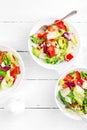 Healthy vegetable salad with fresh greens, lettuce, avocado, tomato, seet pepper and goat cheese. Delicious and nutritious diet d Royalty Free Stock Photo