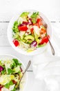 Healthy vegetable salad with fresh greens, lettuce, avocado, tomato, seet pepper and goat cheese. Delicious and nutritious diet d Royalty Free Stock Photo