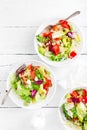 Healthy vegetable salad with fresh greens, lettuce, avocado, tomato, seet pepper and goat cheese. Delicious and nutritious diet di Royalty Free Stock Photo