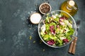 Healthy vegetable salad of fresh tomato, cucumber, onion, spinach, lettuce and pumpkin seeds in bowl. Diet menu. Top view with cop Royalty Free Stock Photo