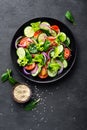 Healthy vegetable salad of fresh tomato, cucumber, onion, spinach, lettuce and sesame on plate. Diet menu Royalty Free Stock Photo