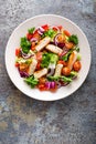 Healthy vegetable salad with grilled chicken breast, fresh lettuce, cherry tomatoes, red onion and pepper Royalty Free Stock Photo