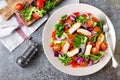 Healthy vegetable salad with grilled chicken breast, fresh lettuce, cherry tomatoes, red onion and pepper Royalty Free Stock Photo