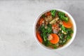 Healthy vegetable soup with kale and lentils, above on white marble Royalty Free Stock Photo