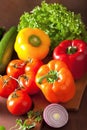 healthy vegetables pepper tomato salad onion on rustic background Royalty Free Stock Photo