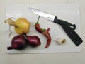 Healthy vegetables are waiting to be cut on a white board