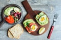 healthy vegetarian breakfast, avocado toast with cucumber, eggs