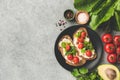 Healthy vegetarian bruschetta or toast with roasted tomatoes and ricotta cheese