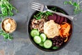 Healthy vegetarian buddha bowl on a dark background