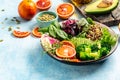 Healthy vegetarian buddha bowl salad with vegetables, avocado, blood orange, broccoli, watermelon radish, spinach, quinoa, pumpkin Royalty Free Stock Photo