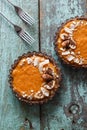 Healthy vegetarian diet. Tasty pumpkin tarts decorated with almo