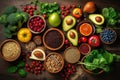 Healthy vegetarian eating and home cooking concept. Vegan ingredients on rustic wooden table with herbs and spices. Top view Royalty Free Stock Photo