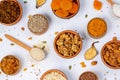 Healthy vegetarian food concept. Assortment of dried fruits, nuts and seeds on white background. Top view. Royalty Free Stock Photo