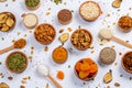 Healthy vegetarian food concept. Assortment of dried fruits, nuts and seeds on white background. Top view. Mixed nuts set closeup. Royalty Free Stock Photo