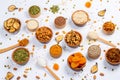 Healthy vegetarian food concept. Assortment of dried fruits, nuts and seeds on white background. Top view. Mixed nuts set closeup. Royalty Free Stock Photo