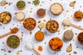 Healthy vegetarian food concept. Assortment of dried fruits, nuts and seeds on white background. Top view. Mixed nuts set closeup. Royalty Free Stock Photo