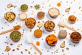 Healthy vegetarian food concept. Assortment of dried fruits, nuts and seeds on white background. Top view. Mixed nuts set closeup. Royalty Free Stock Photo