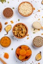 Healthy vegetarian food concept. Assortment of dried fruits, nuts and seeds on white background. Top view. Mixed nuts set closeup. Royalty Free Stock Photo