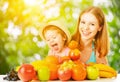 Healthy vegetarian food. happy family mother and baby daughter w Royalty Free Stock Photo