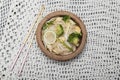 Healthy vegetarian food stir fried Chinese noodles on white fabric background Royalty Free Stock Photo