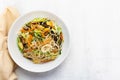 Healthy vegetarian food stir fry noodles add bean sprout mushroom cabbage carrot in plate on wood table Royalty Free Stock Photo