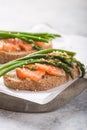 Healthy vegetarian meal. Toast, asparagus, salmon fish. Stone background. Clean eating Diet. Organic food