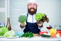 Healthy vegetarian recipe. I choose only healthy ingredients. Man cook hat and apron hold broccoli. Organic vegetables Royalty Free Stock Photo