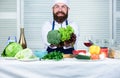 Healthy vegetarian recipe. Man cook hat and apron hold broccoli. Organic vegetables. Healthy nutrition concept. Bearded Royalty Free Stock Photo