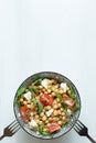 Healthy vegetarian salad, chickpea in a bowl on white background, copy space, top view