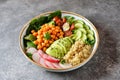 Healthy vegetarian salad with chickpeas, quinoa, cherry tomatoes, cucumber, radish, spinach, avocado and parsley. Ketogenic diet. Royalty Free Stock Photo