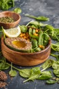 Healthy vegetarian salad with tofu, chickpea, avocado and sunflower seeds. Healthy vegan food concept. Dark background, copy Royalty Free Stock Photo