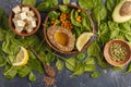 Healthy vegetarian salad with tofu, chickpea, avocado and sunflower seeds. Healthy vegan food concept. Dark background, top Royalty Free Stock Photo