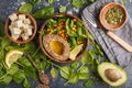 Healthy vegetarian salad with tofu, chickpea, avocado and sunflower seeds. Healthy vegan food concept. Dark background, top