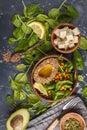 Healthy vegetarian salad with tofu, chickpea, avocado and sunflower seeds. Healthy vegan food concept. Dark background, top Royalty Free Stock Photo