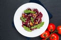 Healthy Vegetarian summer food concept Homemade vegan beetroot and rocket salad in white ceramic plate with copy space