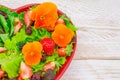 Healthy vegetarian summer salad with edible flowers