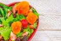 Healthy vegetarian summer salad with edible flowers Royalty Free Stock Photo