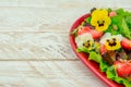 Healthy vegetarian summer salad with edible flowers