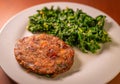 Healthy vegetarian or vegan food, real eggplant and carrot vegetable burger with spinach Royalty Free Stock Photo