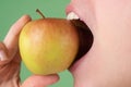 Healthy white teeth close up with an apple. Dental Care. Human Teeth.